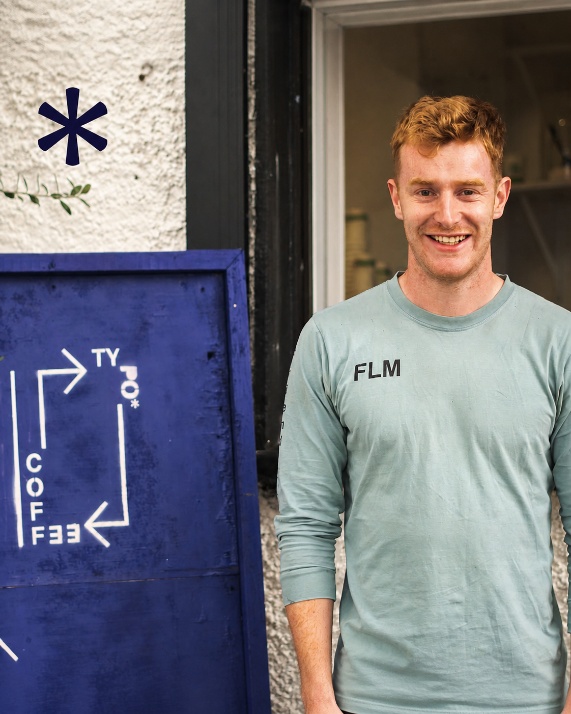 Conor, co-founder of Typo Coffee, at the original Maynooth drive-thru